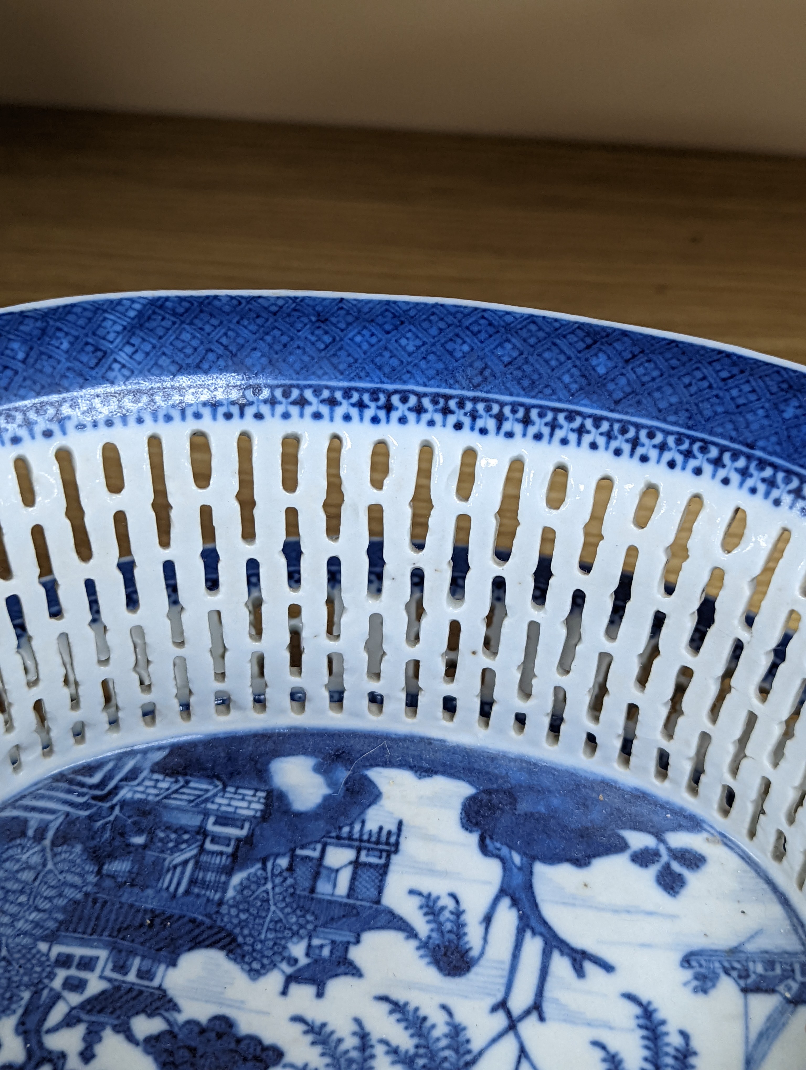 A Chinese blue and white chestnut basket and stand, Qianlong period, basket 11 cms high.